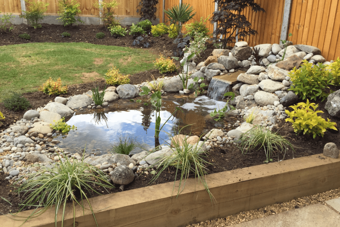 well-maintained pond with water feature